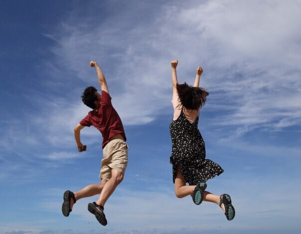 people jumping in happiness