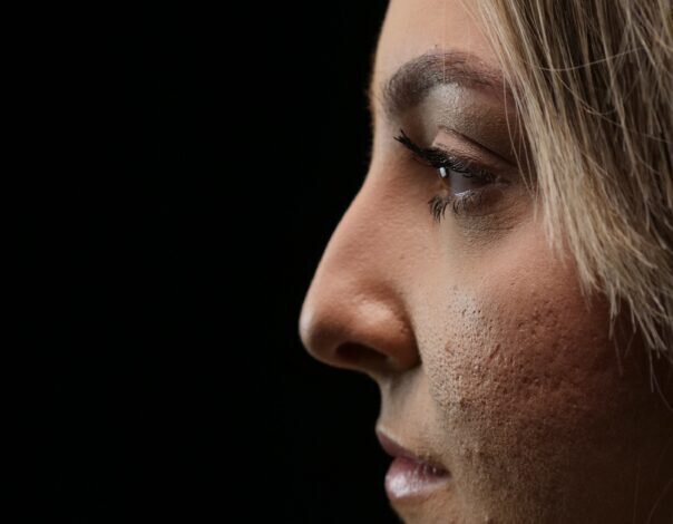 profile of woman's face on a black background