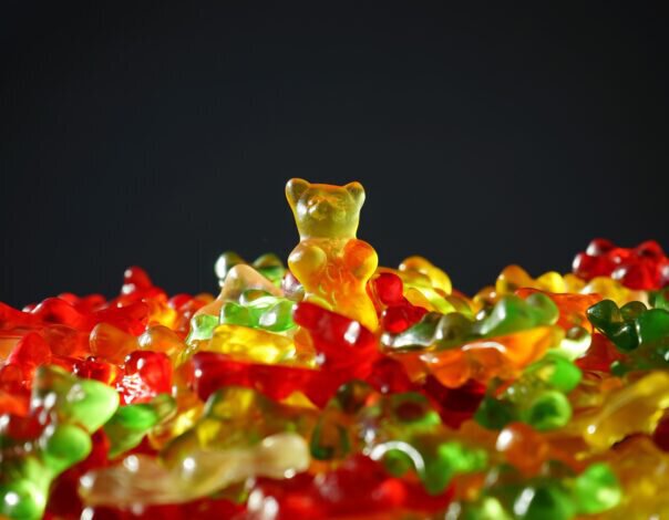 pile of gummy bears on black background