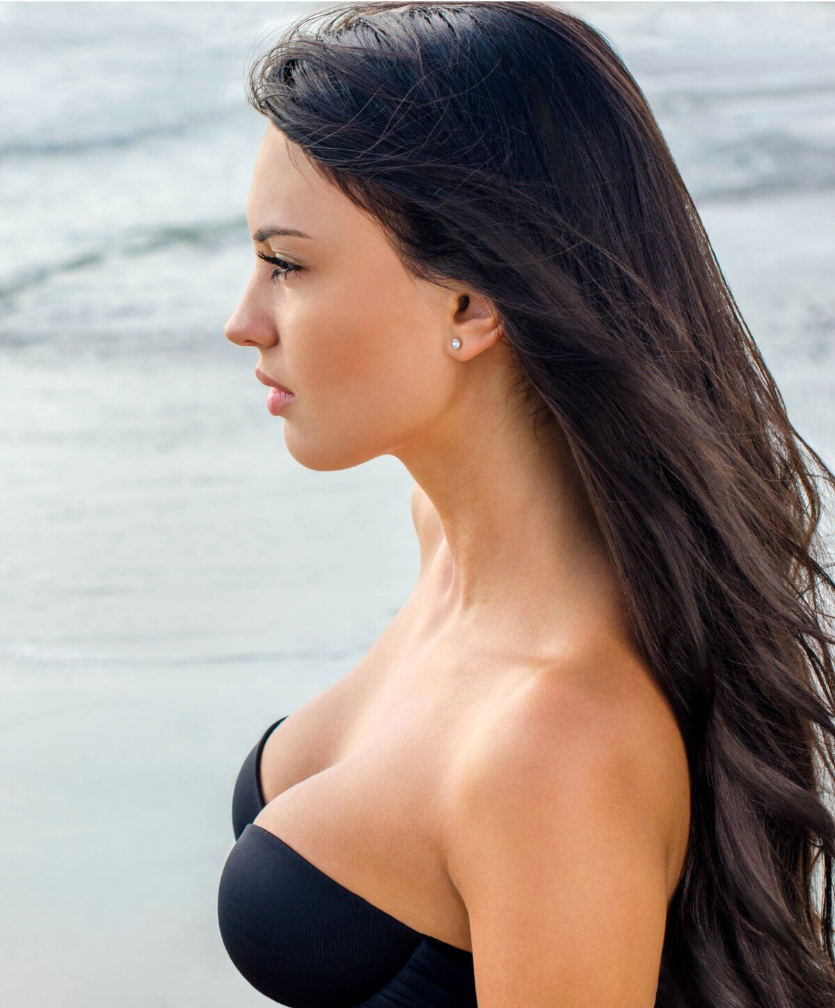 Miami breast augmentation model with black hair